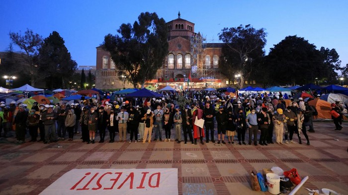 SENSITIVE MATERIAL. THIS IMAGE MAY OFFEND OR DISTURB    Protesters supporting Palestinians in Gaza gather at an encampment, as the conflict between Israel and the Palestinian Islamist group Hamas continues, at the University of California Los Angeles (UCLA), in Los Angeles, California, U.S., May 1, 2024. REUTERS/David Swanson