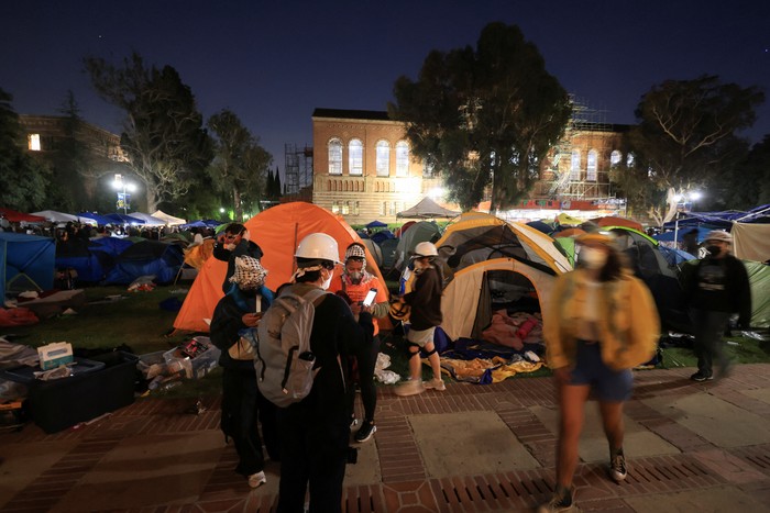 SENSITIVE MATERIAL. THIS IMAGE MAY OFFEND OR DISTURB    Protesters supporting Palestinians in Gaza gather at an encampment, as the conflict between Israel and the Palestinian Islamist group Hamas continues, at the University of California Los Angeles (UCLA), in Los Angeles, California, U.S., May 1, 2024. REUTERS/David Swanson