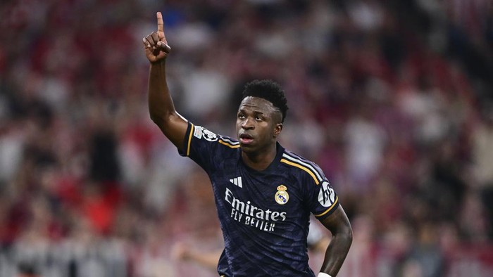 Real Madrids Vinicius Junior celebrates after scoring his sides second goal on a penalty kick during the Champions League semifinal first leg soccer match between Bayern Munich and Real Madrid at the Allianz Arena in Munich, Germany, Tuesday, April 30, 2024. (AP Photo/Christian Bruna)