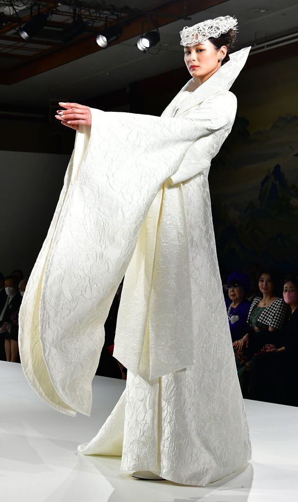 TOKYO, JAPAN - MARCH 07:   A model walks the runway during Yumi Katsura 'New Japanese Wedding' at Meiji Kinenkan on March 7, 2023 in Tokyo, Japan.  (Photo by Jun Sato/WireImage)