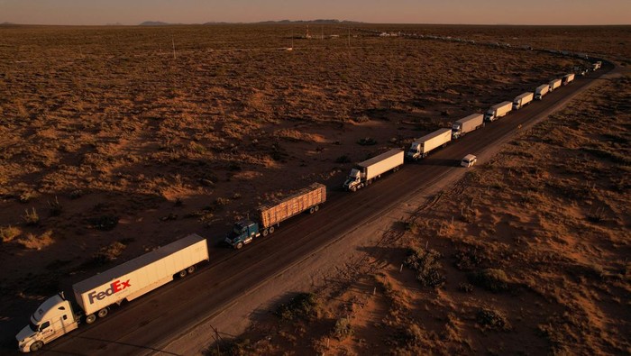 A drone view shows trucks waiting in a queue to cross into the United States through the Jeronimo-Santa Teresa International Crossing, which connects the city of Ciudad Juarez with Santa Teresa, New Mexico, after the Texas Department of Public Safety (DPS) increased security inspections on all cargo vehicles entering through El Paso, Texas, in Ciudad Juarez, Mexico May 2, 2024. REUTERS/Jose Luis Gonzalez