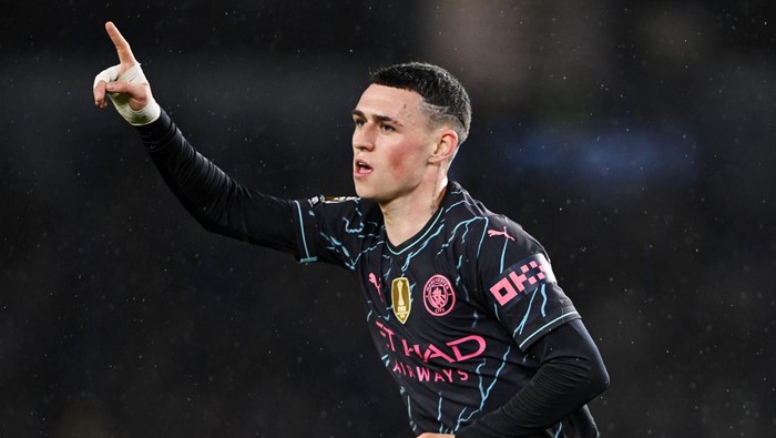 BRIGHTON, ENGLAND - APRIL 25: Phil Foden of Manchester City celebrates scoring his teams third goal during the Premier League match between Brighton & Hove Albion and Manchester City at American Express Community Stadium on April 25, 2024 in Brighton, England. (Photo by Mike Hewitt/Getty Images)