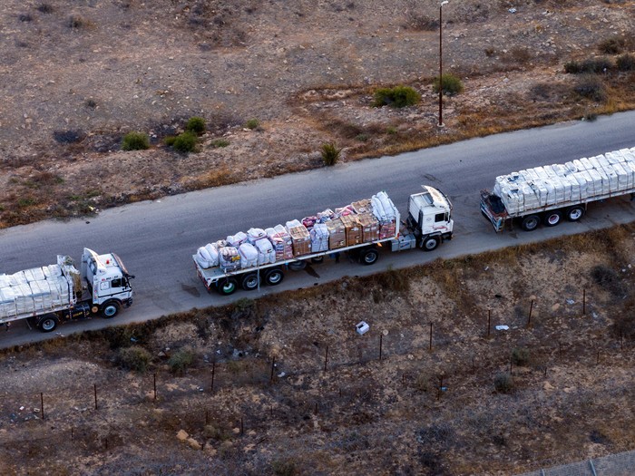 A drone picture of a line of trucks waiting on an Egyptian road along the border with Israel, near the Rafah border crossing with the Gaza Strip May 2, 2024. REUTERS/Oren Alon