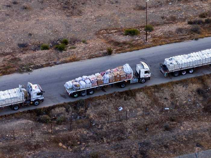 A drone picture of a line of trucks waiting on an Egyptian road along the border with Israel, near the Rafah border crossing with the Gaza Strip May 2, 2024. REUTERS/Oren Alon