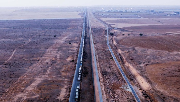 A drone picture of a line of trucks waiting on an Egyptian road along the border with Israel, near the Rafah border crossing with the Gaza Strip May 2, 2024. REUTERS/Oren Alon