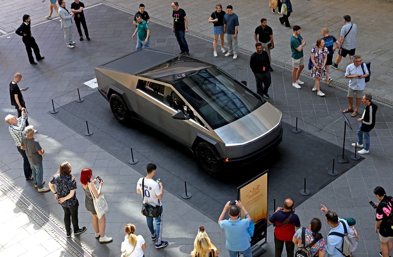 People gather around the Cybertruck vehicle by Tesla at the Mall of Berlin in Berlin, Germany, May 2, 2024. REUTERS/Lisi Niesner