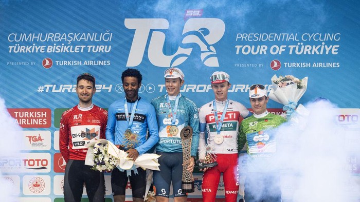 ISTANBUL, TURKIYE - APRIL 28: Due to adverse weather conditions in Istanbul, Turkiye the 8th stage of the 2024 Presidential Cycling Tour of Turkiye (TUR 2024) was neutralized on April 28, 2024. With the last stage neutralized, Frank van den Broek (3rd L) from Dsm-Firmenich PostNL team secured the victory. Merhawi Kudus (2nd L) from Terengganu team claimed second place in the general classification, while British cyclist Paul Double (3rd R) from Polti Kometa team finished third. (Photo by Elif Ozturk/Anadolu via Getty Images)