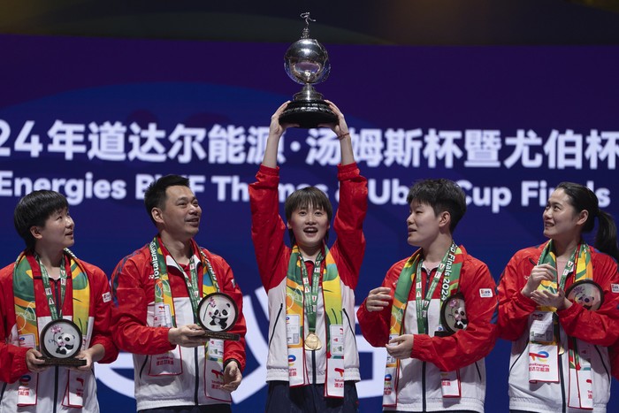 Chinas Chen Yu Fei holds up the Uber Cup after leading Team China 3-0 to win over Team Indonesia in the final of the Uber Cup held in Chengdu in southwestern Chinas Sichuan Province, Sunday, May 5, 2024. (AP Photo/Ng Han Guan)