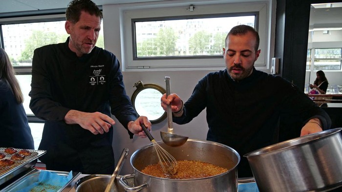 French chef Amandine Chaignot prepares one of the recipes that will be available at the athletes' village during the Paris 2024 Olympic and Paralympic Games, during a press presentation in Paris, France, April 30, 2024. REUTERS/Lucien Libert