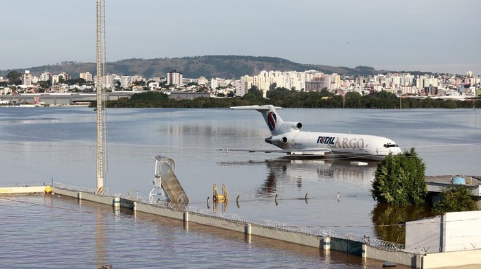 A cargo plane sits on a flooded runway at the airport in Porto Alegre, Rio Grande do Sul, Brazil, May 6, 2024. REUTERS/Diego Vara