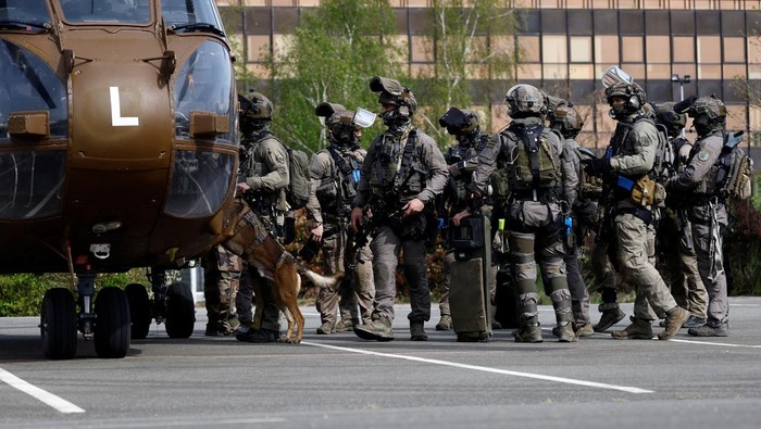 Gendarmes of the French National Gendarmerie Intervention Group (GIGN) use explosives to storm a building, as they take part in a drill, as part of their preparation for the upcoming Paris 2024 Olympic Games, near Paris, France, April 26, 2024. REUTERS/Christian Hartmann