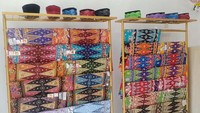 Berbagai kain dan peci yang menjadi ciri khas warga Betawi juga dipamerkan.  