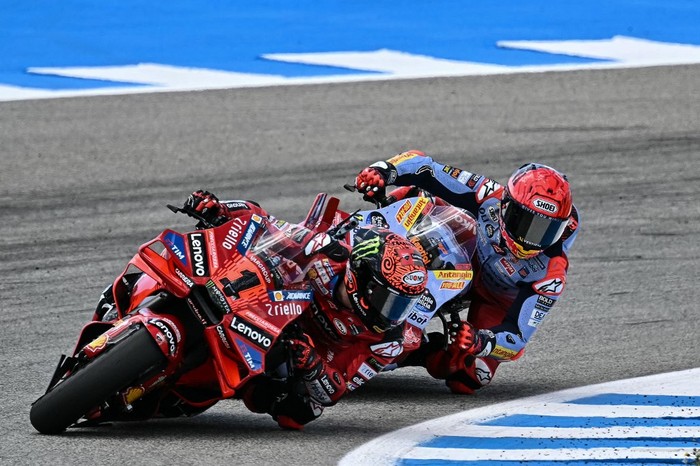 Ducati Italian rider Francesco Bagnaia (Front) and Ducati Spanish rider Marc Marquez compete during the MotoGP Spanish Grand Prix race at the Jerez racetrack in Jerez de la Frontera on April 28, 2024. (Photo by JORGE GUERRERO / AFP)