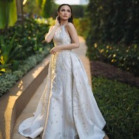 Mahalini mempercayakan desainer Hian Tjen membuatkan gaun untuk acara resepsi. Foto: Instagram/@axioo @thebridestory @hiantjen @dhirmanputra