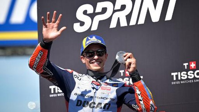 Second-placed Gresini Racing MotoGPs Spanish rider Marc Marquez celebrates on the podium of the French MotoGP Grand Prix sprint race at the Bugatti circuit in Le Mans, northwestern France, on May 11, 2024. (Photo by Lou BENOIST / AFP)