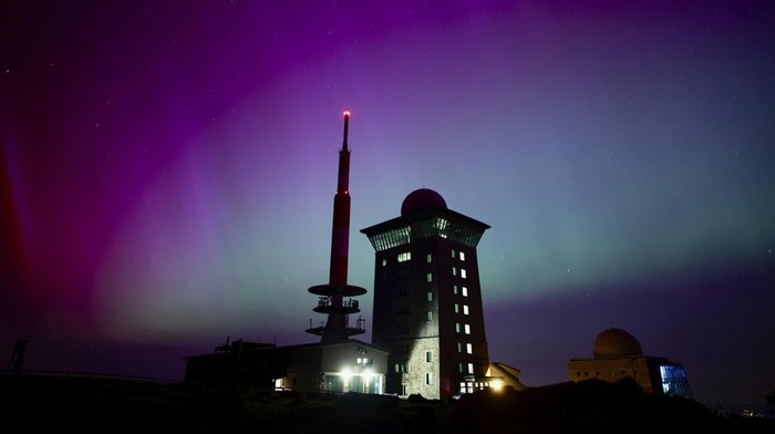 Switzerland Northern Lights The Northern Lights, or Aurora Borealis, illuminate the night sky over the mountains in Le Col des Mosses pass, Ormont-Dessous, Switzerland, during the early hours of Saturday, May 11, 2024. (Jean-Christophe Bott/Keystone via AP)