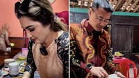 Datang ke acara nikahan ART di Sragen, Anang dan Ashanty tampak menikmati hidangan tradisional yang ada di pesta tersebut. Foto: Pool/Site