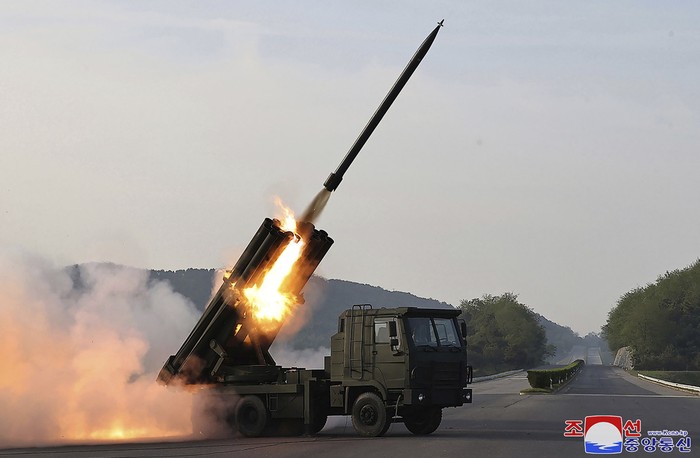 In this photo provided by the North Korean government, North Korean leader Kim Jong Un, center, supervises a test firing of a new multiple rocket launch system at an undisclosed place in North Korea on May 10, 2024. Independent journalists were not given access to cover the event depicted in this image distributed by the North Korean government. The content of this image is as provided and cannot be independently verified. Korean language watermark on image as provided by source reads: 
