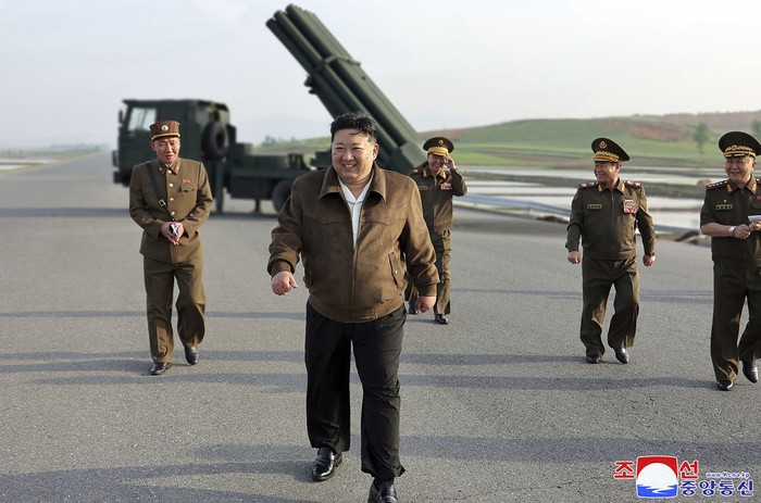 In this photo provided by the North Korean government, North Korean leader Kim Jong Un, center, supervises a test firing of a new multiple rocket launch system at an undisclosed place in North Korea on May 10, 2024. Independent journalists were not given access to cover the event depicted in this image distributed by the North Korean government. The content of this image is as provided and cannot be independently verified. Korean language watermark on image as provided by source reads: 