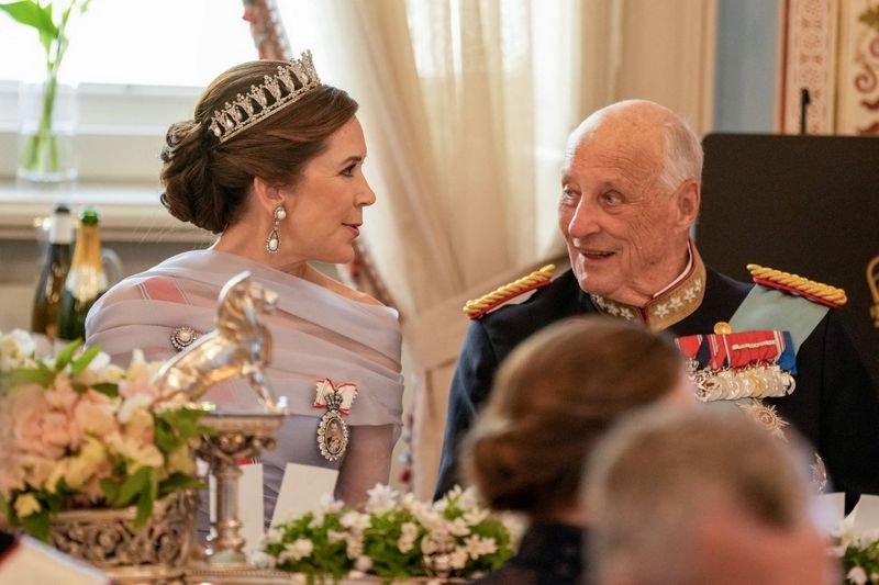 King Harald V of Norway (R) and Queen Mary of Denmark speak during a gala dinner at the The Royal Palace in Oslo, Norway, on May 14, 2024, during the official state visit of King and Queen of Denmark. (Photo by Heiko Junge / NTB / AFP) / Norway OUT