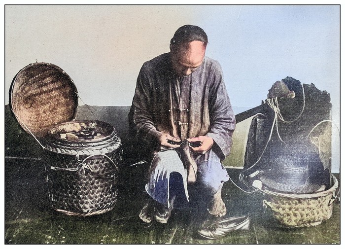 Antique black and white photograph of people from islands in the Caribbean and in the Pacific Ocean; Cuba, Hawaii, Philippines and others: Chinese cobbler
