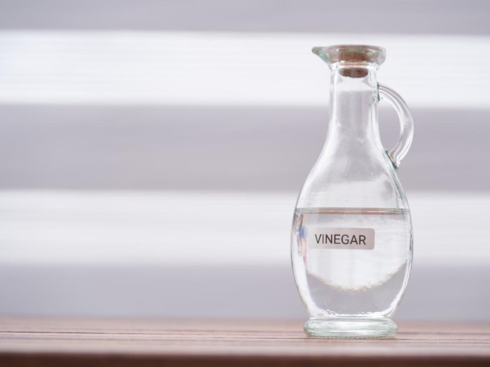 white vinegar on wood table top