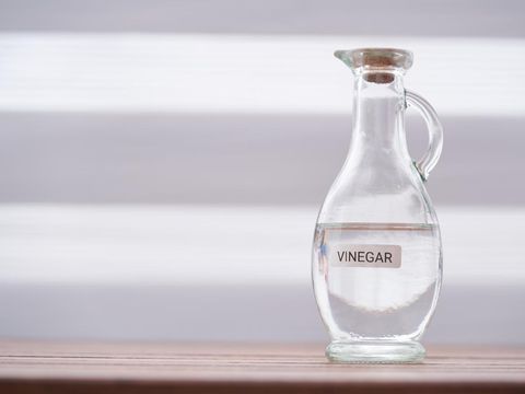 white vinegar on wood table top