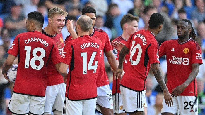 Manchester Uniteds Danish striker #11 Rasmus Hojlund (2L) celebrates scoring the teams second goal during the English Premier League football match between Brighton and Hove Albion and Manchester United at the American Express Community Stadium in Brighton, southern England on May 19, 2024. (Photo by Glyn KIRK / AFP) / RESTRICTED TO EDITORIAL USE. No use with unauthorized audio, video, data, fixture lists, club/league logos or live services. Online in-match use limited to 120 images. An additional 40 images may be used in extra time. No video emulation. Social media in-match use limited to 120 images. An additional 40 images may be used in extra time. No use in betting publications, games or single club/league/player publications. /