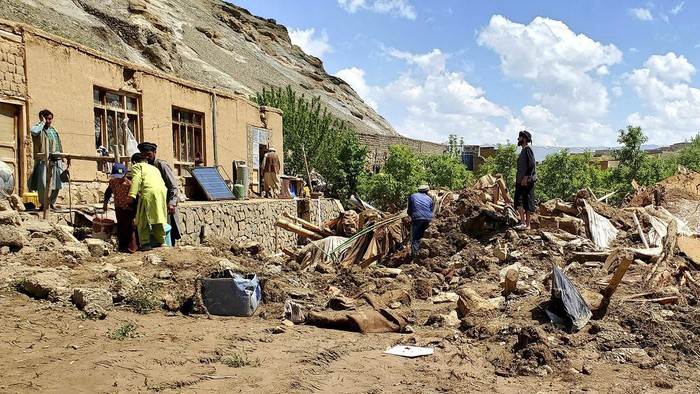 Damaged houses are seen after heavy flooding in Ghor province in western Afghanistan Saturday, May 18, 2024. Flash floods from heavy seasonal rains in Ghor province in western Afghanistan killed dozens of people and dozens remain missing, a Taliban official said on Saturday, adding the death toll was based on preliminary reports and might rise. (AP Photo/Omid Haqjoo)