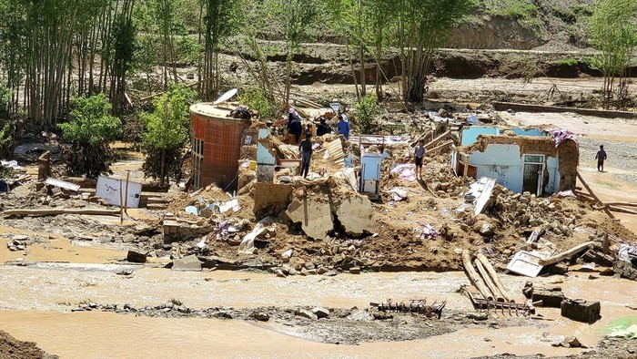 Damaged houses are seen after heavy flooding in Ghor province in western Afghanistan Saturday, May 18, 2024. Flash floods from heavy seasonal rains in Ghor province in western Afghanistan killed dozens of people and dozens remain missing, a Taliban official said on Saturday, adding the death toll was based on preliminary reports and might rise. (AP Photo/Omid Haqjoo)