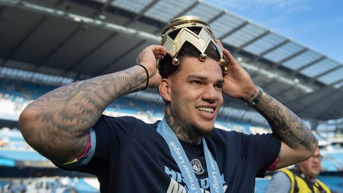 MANCHESTER, ENGLAND - MAY 19: Manchester City goalkeeper Ederson with part of the Premier League trophy after the Premier League match between Manchester City and West Ham United at Etihad Stadium on May 19, 2024 in Manchester, England.(Photo by Visionhaus/Getty Images)