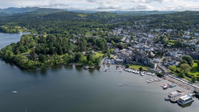 A pleasure boat leaves from a jetty on the banks of Lake Windermere, the largest lake in England, after a British government minister described it's water quality as 