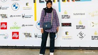 Berpose sejenak selepas scan tiket di depan flyer besar The Halal Village Festival.