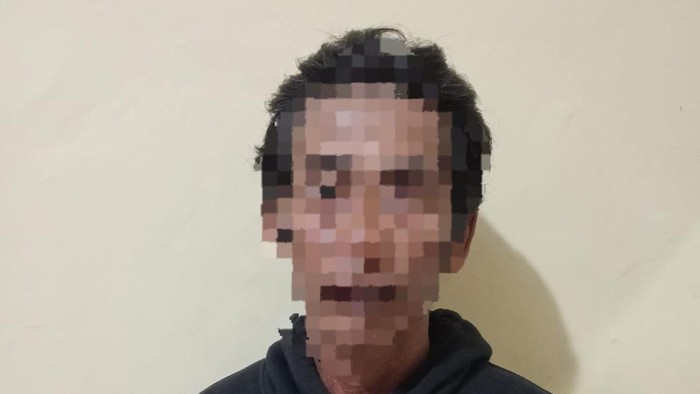 Masturi saat ditangkap setelah membacok tetangganya