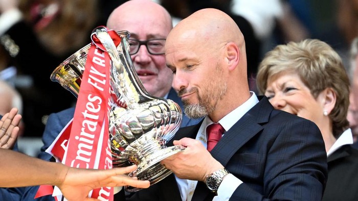 LONDON, ENGLAND - MAY 25:  Erik ten Hag, Manager of Manchester United, lifts the Emirates FA Cup Trophy after his teams victory after the Emirates FA Cup Final match between Manchester City and Manchester United at Wembley Stadium on May 25, 2024 in London, England. (Photo by Michael Regan - The FA/The FA via Getty Images)