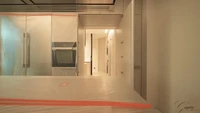 Ini adalah area dapur dan di belakangnya terdapat area laundry. Di dapur, akan tersedia kompor, kulkas dua pintu, oven, dan kitchen island.