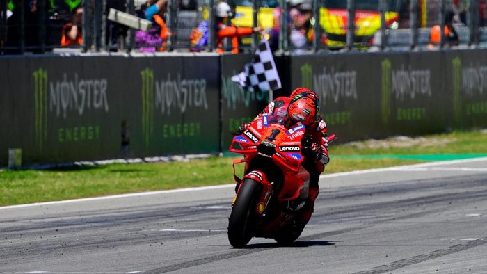 Ducati Italian rider Francesco Bagnaia crosses the finish line in first place during the MotoGP Race of the Moto Grand Prix of Catalonia at the Circuit de Catalunya on May 26, 2024 in Montmelo on the outskirts of Barcelona. (Photo by Josep LAGO / AFP)