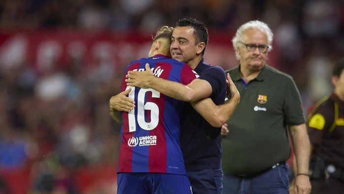 SEVILLE, SPAIN - MAY 26: Fermin Lopez of FC Barcelona celebrates after scoring the teams second goal with Xavi, Head Coach of FC Barcelona, during the LaLiga EA Sports match between Sevilla FC and FC Barcelona at Estadio Ramon Sanchez Pizjuan on May 26, 2024 in Seville, Spain. (Photo by Fran Santiago/Getty Images)