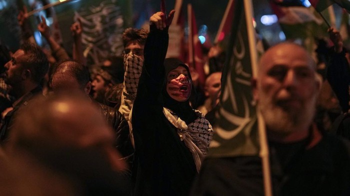 Protesters chant anti Israel slogans during a protest in solidarity with Gaza, outside the Israeli consulate in Istanbul, Monday, May 27, 2024. (AP Photo/Khalil Hamra)