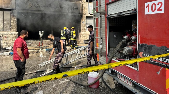 Palestinian Civil Defense members work at the central vegetables market after an Israeli raid in Ramallah in the Israeli-occupied West Bank May 30,2024. REUTERS/Ali Sawafta