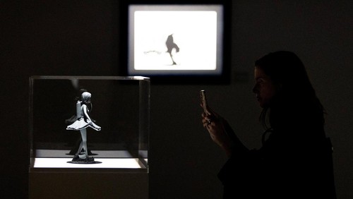 People look at some of the work by the artist Banksy during a media preview for an upcoming show in Toronto, Canada May 28, 2024. REUTERS/Carlos Osorio
