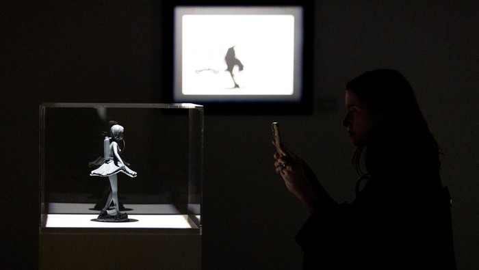 People look at some of the work by the artist Banksy during a media preview for an upcoming show in Toronto, Canada May 28, 2024. REUTERS/Carlos Osorio