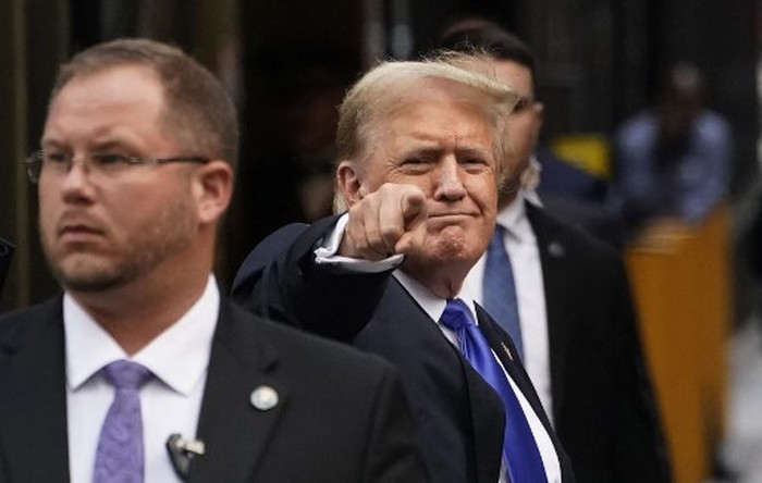 Former US President and Republican presidential candidate Donald Trump points as he arrives back at Trump Tower after being convicted in his criminal trial in New York City, on May 30, 2024. A panel of 12 New Yorkers were unanimous in their determination that Donald Trump is guilty as charged -- but for the impact on his election prospects, the jury is still out. The Republican billionaire was convicted of all 34 charges in New York on May 30, 2024, and now finds himself bidding for a second presidential term unsure if hell be spending 2025 in the Oval Office, on probation or in jail. (Photo by TIMOTHY A. CLARY / AFP)