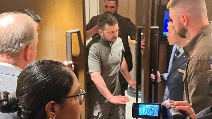 Ukraines President Volodymyr Zelensky (C) leaves a room after a meeting with US Secretary of Defence Lloyd Austin (not pictured) on the sidelines of the 21st Shangri-La Dialogue summit at the Shangri-La Hotel in Singapore on June 2, 2024. (Photo by Martin ABBUGAO / AFP)