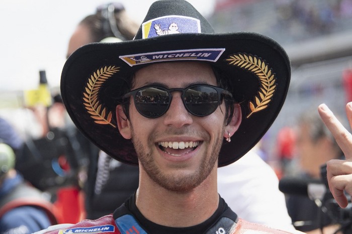 AUSTIN, TEXAS - APRIL 14: Enea Bastianini of Italy and Ducati Lenovo Team celebrates the third place under the podium during the MotoGP Race during the MotoGP Of The Americas - Race on April 14, 2024 in Austin, Texas.   Mirco Lazzari gp/Getty Images/AFP (Photo by Mirco Lazzari gp / GETTY IMAGES NORTH AMERICA / Getty Images via AFP)