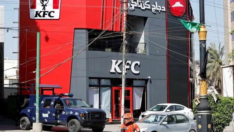 A Federal police vehicle is parked near a KFC fast food restaurant following an attack in Baghdad, Iraq May 27, 2024. (Reuters)