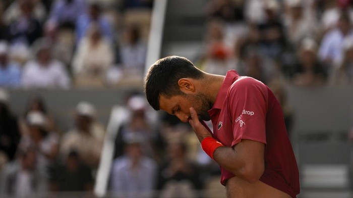 Serbias Novak Djokovic reacts after missing a shot against Argentinas Francisco Cerundolo during their fourth round match of the French Open tennis tournament at the Roland Garros stadium in Paris, Monday, June 3, 2024. (AP Photo/Thibault Camus)
