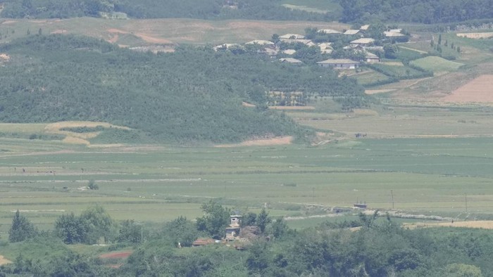 North Korea's town Kaepoong behind a military guard post, bottom, is seen from the unification observatory in Paju, South Korea, Tuesday, June 4, 2024. South Korea’s government has approved the suspension of a contentious military agreement with North Korea, a step that would allow it to take tougher responses to North Korean provocations. (AP Photo/Lee Jin-man)