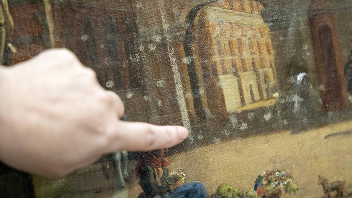 A painting saved from Boersen during the fire is shown at the National Museum's warehouse in Vinge, Denmark, on Tuesday, June 4, 2024. The painting has water damage from the salt water used for fire fighting and handling damage from the rescue. Boersen in Copenhagen caught fire on April 16, 2024. More than 300 art objects were saved from the burning building. (Ida Marie Odgaard/Ritzau Scanpix via AP)