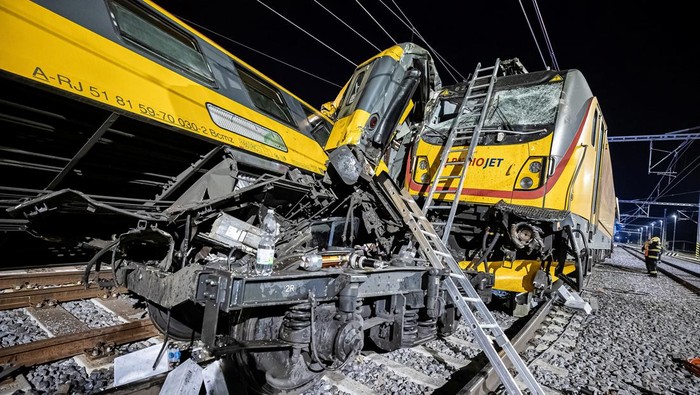 Firefighters work at the scene of a train crash in Pardubice, Czech Republic, in this handout image released on June 6, 2024. Regional Fire Rescue Service of the Pardubice Region/Handout via REUTERS ATTENTION EDITORS - THIS IMAGE HAS BEEN SUPPLIED BY A THIRD PARTY. NO RESALES. NO ARCHIVES